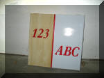 Protected vs. unprotected (yellowed) flexible sign face material.