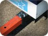 Outriggers lock in extended position, detering theft