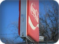 PAN-FORMED COCA-COLA FACE