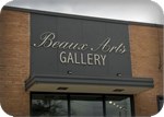 Beaux Arts unlit metal lettering, spotlighted, in Texas