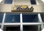 Main Street Bridal channel letters on a gold backplate with push-through lettering in Texas